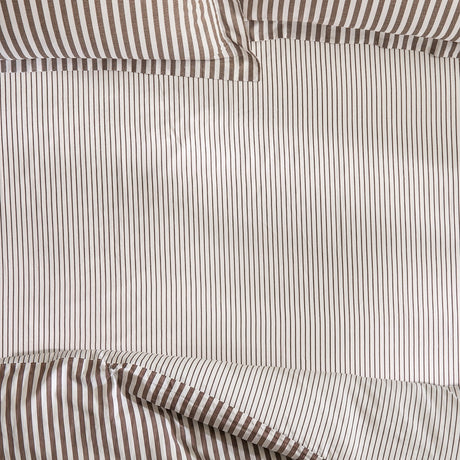 Hebden Striped Cotton Fitted Sheet in Espresso Brown, close-up of pure cotton fabric with narrow brown pinstripes on an off-white ground and elasticated corner detail.