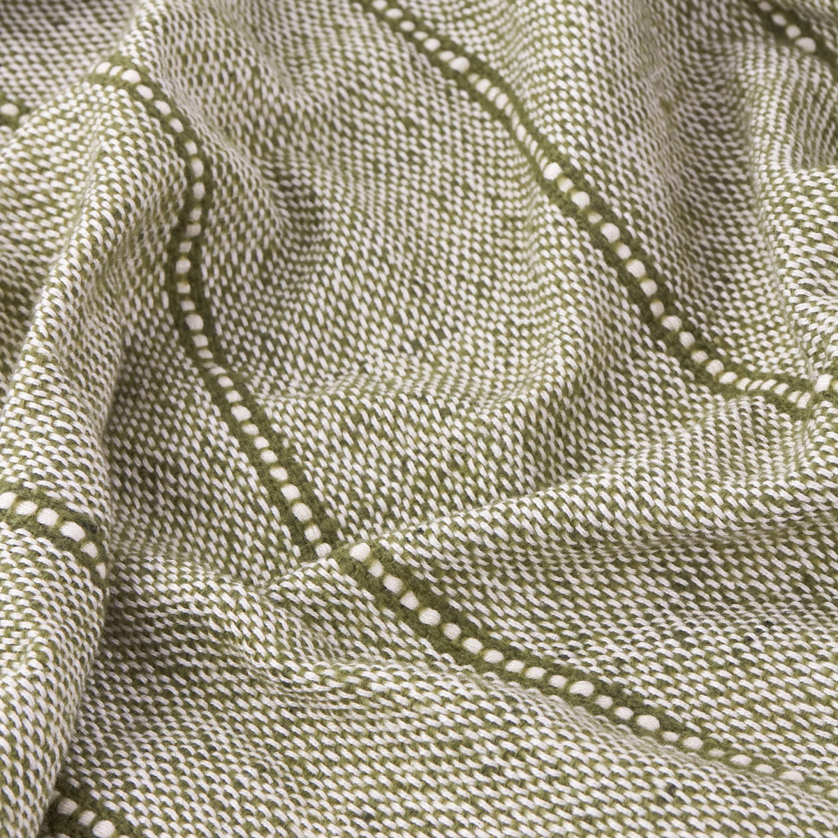Close-up of the Hedon Striped Polyester Throw in moss green, showing the woven two-tone texture with a subtle linear stripe pattern in soft folds.