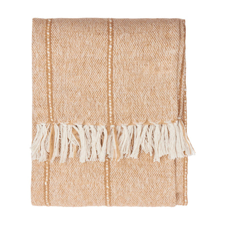 Hedon Striped Polyester Throw in natural sand tone with woven texture, thin stripes, and knotted cream fringe, folded on a plain white background.