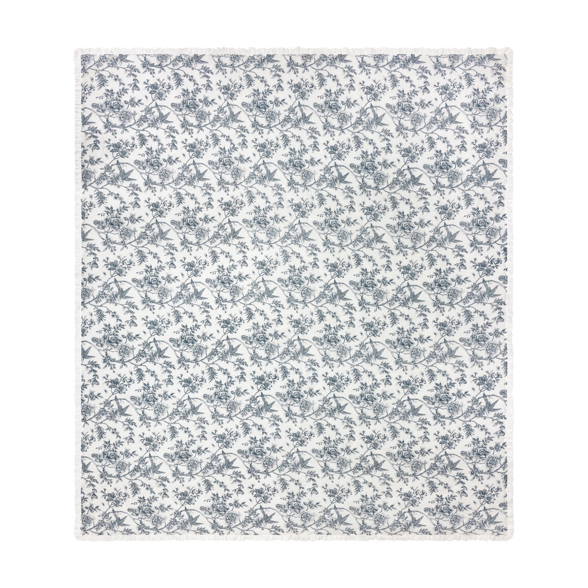 Hermione linen cotton bedspread in ivory blue, quilted diamond-pattern fabric with a fine-line Toile de Jouy floral and bird print, finished with a ruffled edge, shown on a white background.