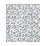 Hermione linen cotton bedspread in ivory blue, quilted diamond-pattern fabric with a fine-line Toile de Jouy floral and bird print, finished with a ruffled edge, shown on a white background.