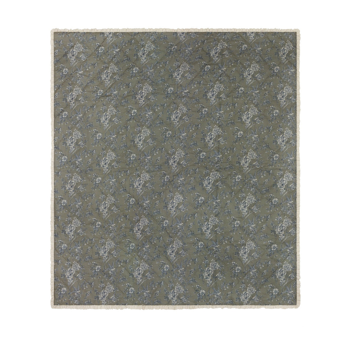 Hermione Linen Cotton Bedspread in Moss, a quilted throw-over with cream and blue Toile de Jouy floral print, finished with a cream ruffled frill edge on a plain background.
