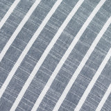 Close-up of the Hessle Stripe cotton cushion in navy, showing yarn-dyed diagonal stripes in navy and white woven fabric.