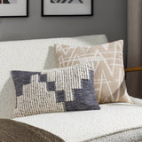 Himal Abstract Cotton Cushion in Dusk, an oblong lumbar cushion with a stepped grey and cream design mixing flat weave and raised loop texture, shown on a white sofa beside a beige patterned cushion.