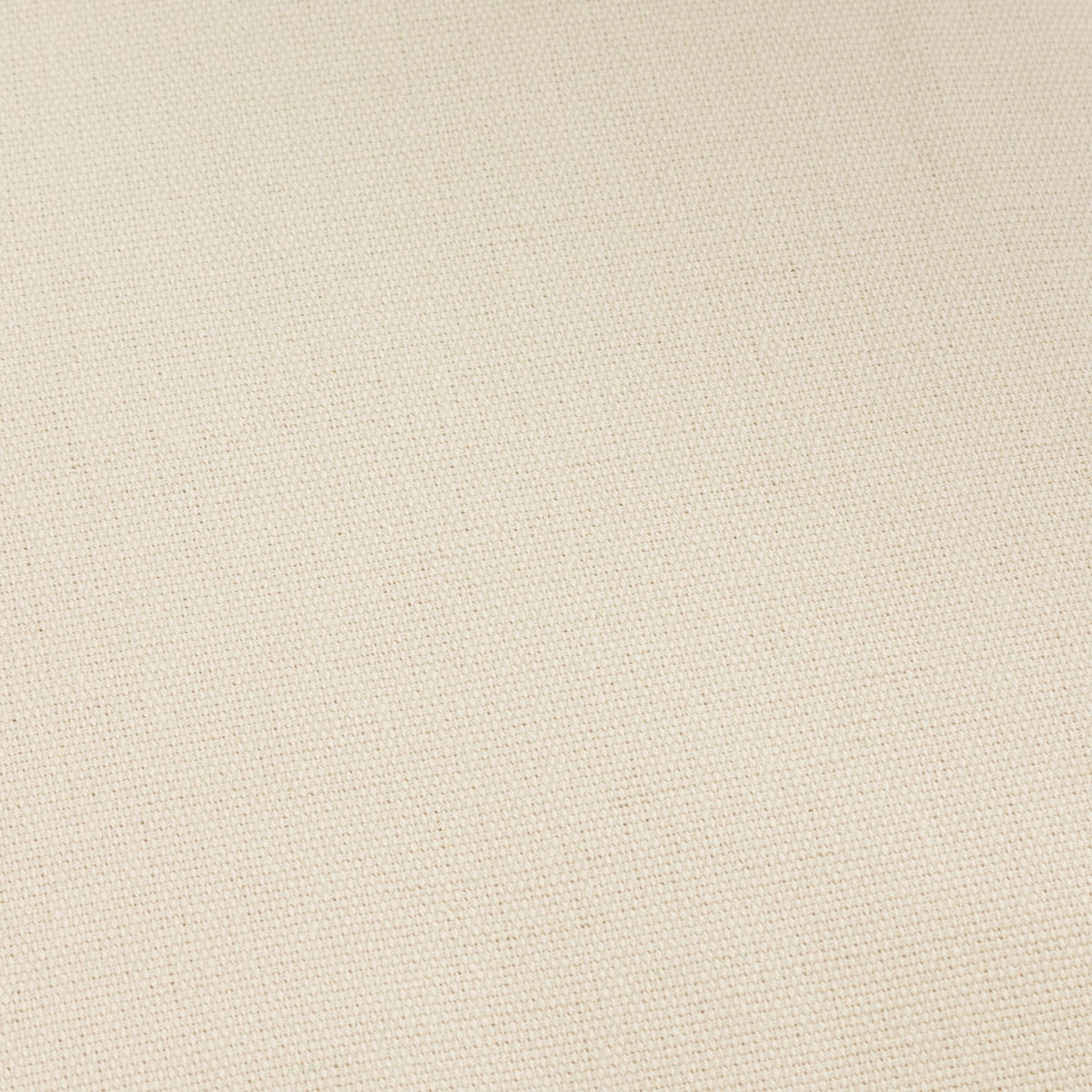 Close-up of the Holmfirth cushion’s natural cotton canvas fabric, showing its tightly woven texture and plain finish.