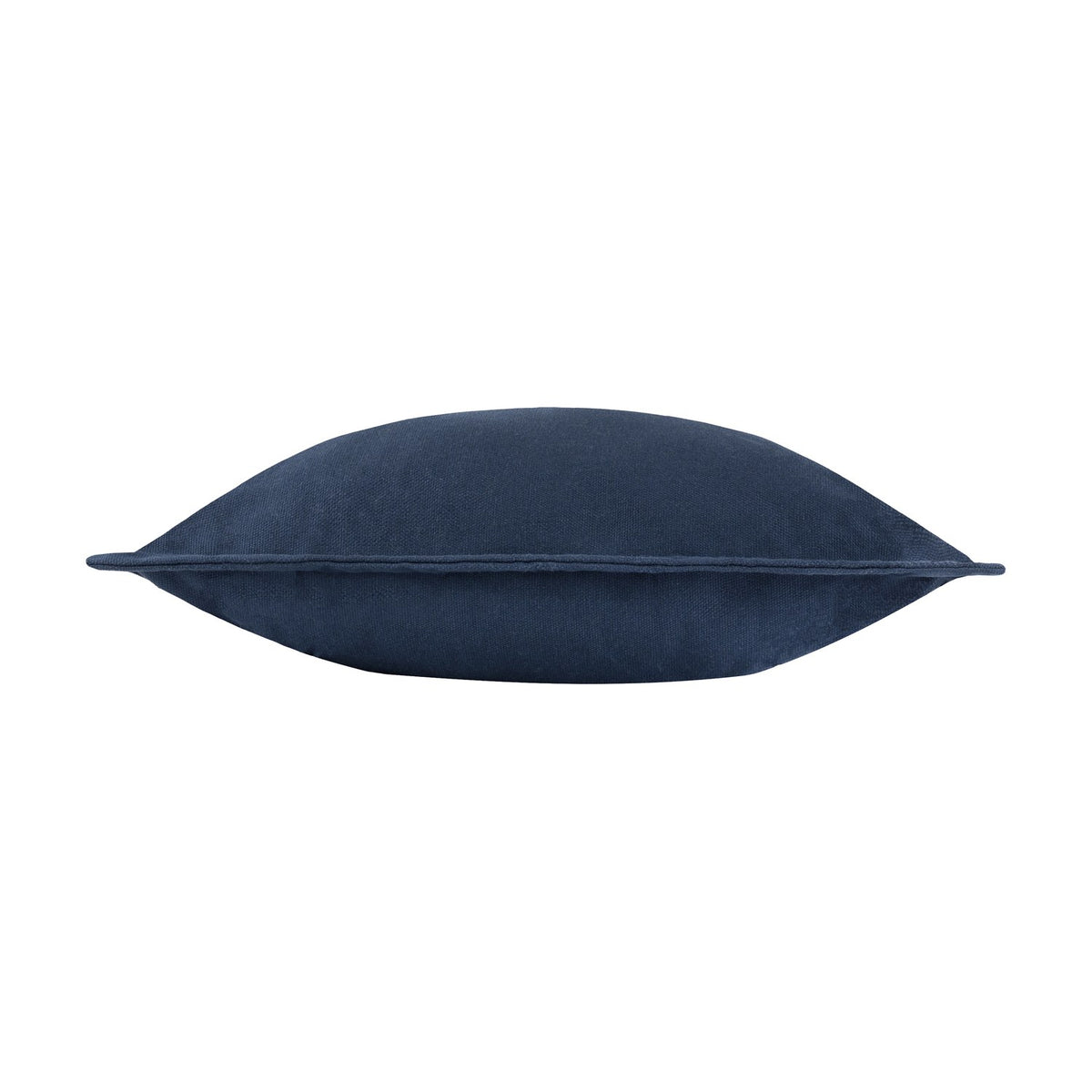 Side view of the Holmfirth navy cushion in cotton canvas, showing its plump shape and stitched edge seam against a plain white background.