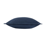 Side view of the Holmfirth navy cushion in cotton canvas, showing its plump shape and stitched edge seam against a plain white background.