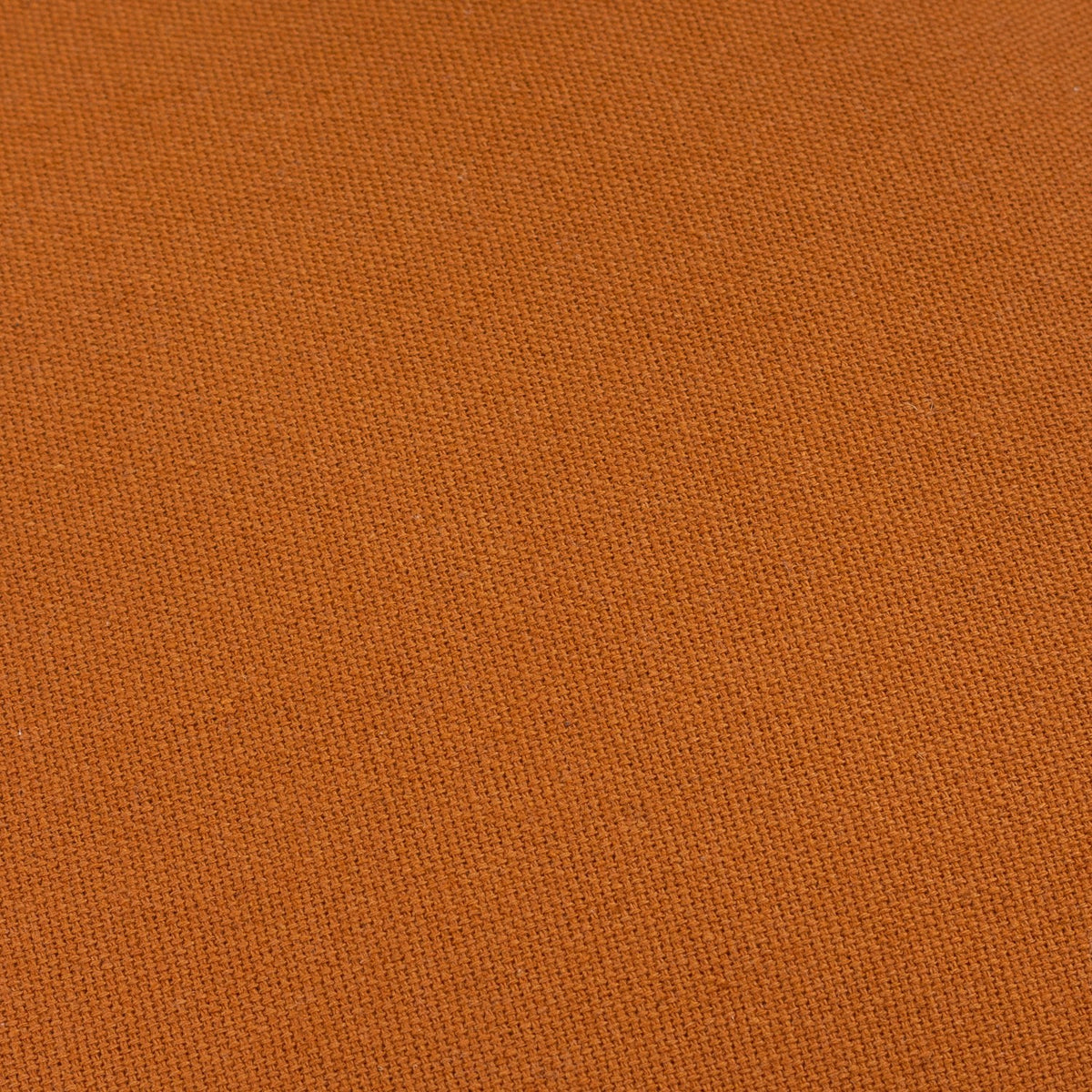 Close-up of the Holmfirth Canvas cushion's pecan orange 100% cotton canvas fabric, showing its tight, textured weave.