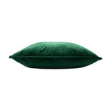 Hortus Animal Velvet Cushion in emerald, shown side-on with piped edging and plump velvet fill against a plain white background.