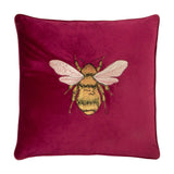 Hortus Animal Velvet Cushion in fuchsia, square with piped edge, featuring a centrally embroidered bee in gold and amber with pale rose wings, shown on a plain white background.