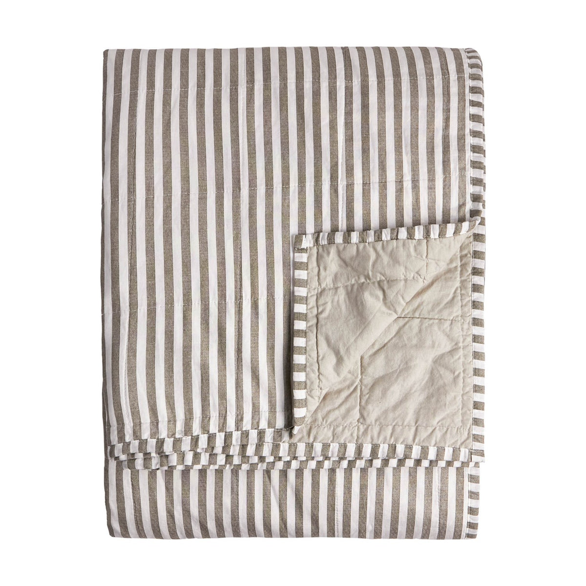 Folded Hebden cotton bedspread in mole and white stripe, showing quilted stone percale reverse corner, on a plain white background.