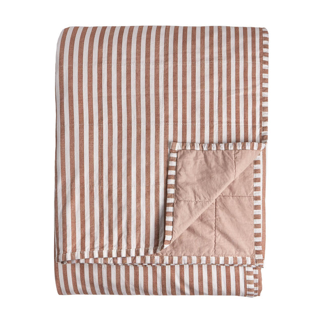 Hebden Percale Cotton Bedspread in Pecan/Cotta, folded to show pecan-brown and white striped cotton on one side and a plain blush reverse, on a white background.