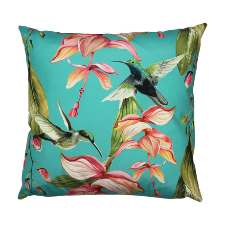Square polyester outdoor cushion in blue-green with two hummingbirds and trailing pink and coral tropical flowers, shown on a plain white background.