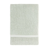 Hebden Plain Cotton Towel in Bay Green, folded flat with a textured waffle weave and off-white contrast border, shown on a plain white background.