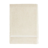 Hebden Plain Cotton Towel in stone, folded flat with a textured waffle weave and plain woven border, shown on a white background.