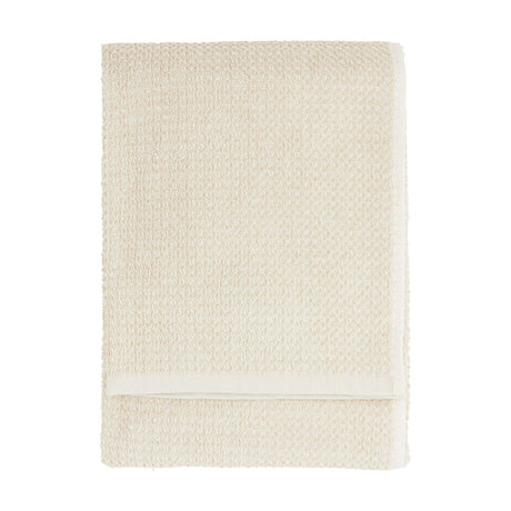 Hebden Plain Cotton Towel in stone, folded flat with a textured waffle weave and plain woven border, shown on a white background.