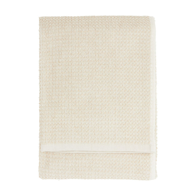 Hebden Plain Cotton Towel in stone, folded flat with a textured waffle weave and plain woven border, shown on a white background.