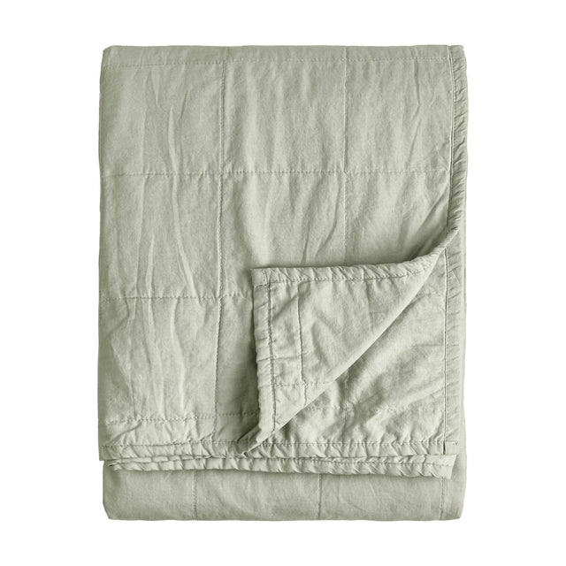 Hebden Percale Cotton Bedspread in Bay Green, folded showing a channel-quilted grid pattern and soft cotton finish, on a plain white background.