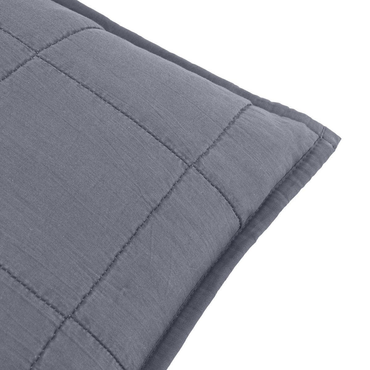 Close-up of the Hebden Percale Cotton Cushion in denim blue, showing square-grid quilted stitching and an Oxford border edge on a plain white background.