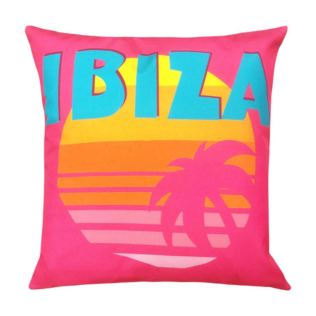 Square pink polyester outdoor cushion printed with "IBIZA" in blue lettering above a striped sunset and palm tree graphic, shown on a white background.