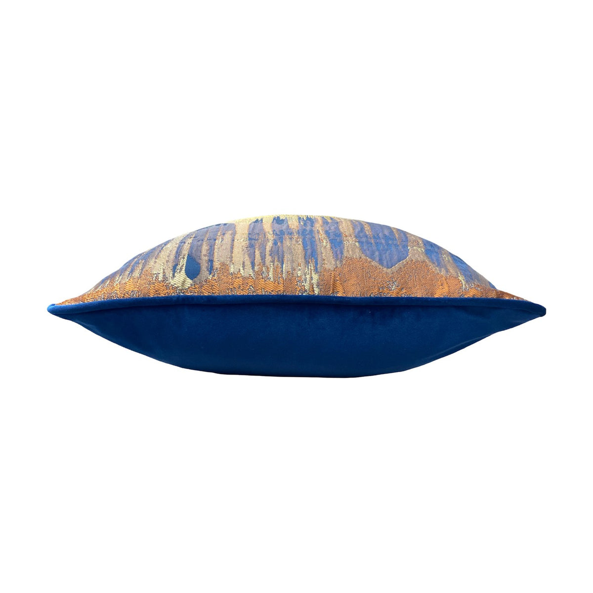 Side view of the Inca Jacquard Velvet Cushion showing its plump square shape, with a woven abstract blue, gold and silver front and plain royal blue velvet reverse, set against a white background.