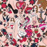 Inked Reversible Abstract Duvet Cover Set in blush, featuring a tattoo-style print with red hearts, roses, pin-up figures and banners reading Trouble Maker and Wild Flower.