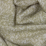 Isla Plain Polyester Throw in green, close-up of woven fabric showing a two-tone herringbone texture in sage green and cream.