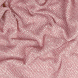 Isla Plain Polyester Throw in Heather, a rumpled woven blanket with a dusky pink, twill-textured surface flecked with paler tones for a heathered finish.