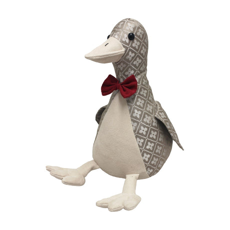 Jacquard duck-shaped door stop with grey and off-white floret-diamond pattern, cream suede-feel front, feet and beak, red bow tie, and black bead eyes.