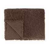Jaye Velvet Cotton Bedspread in Bitter Chocolate, folded to show quilted brown velvet face and matte reverse with frayed fringe trim, on a white background.