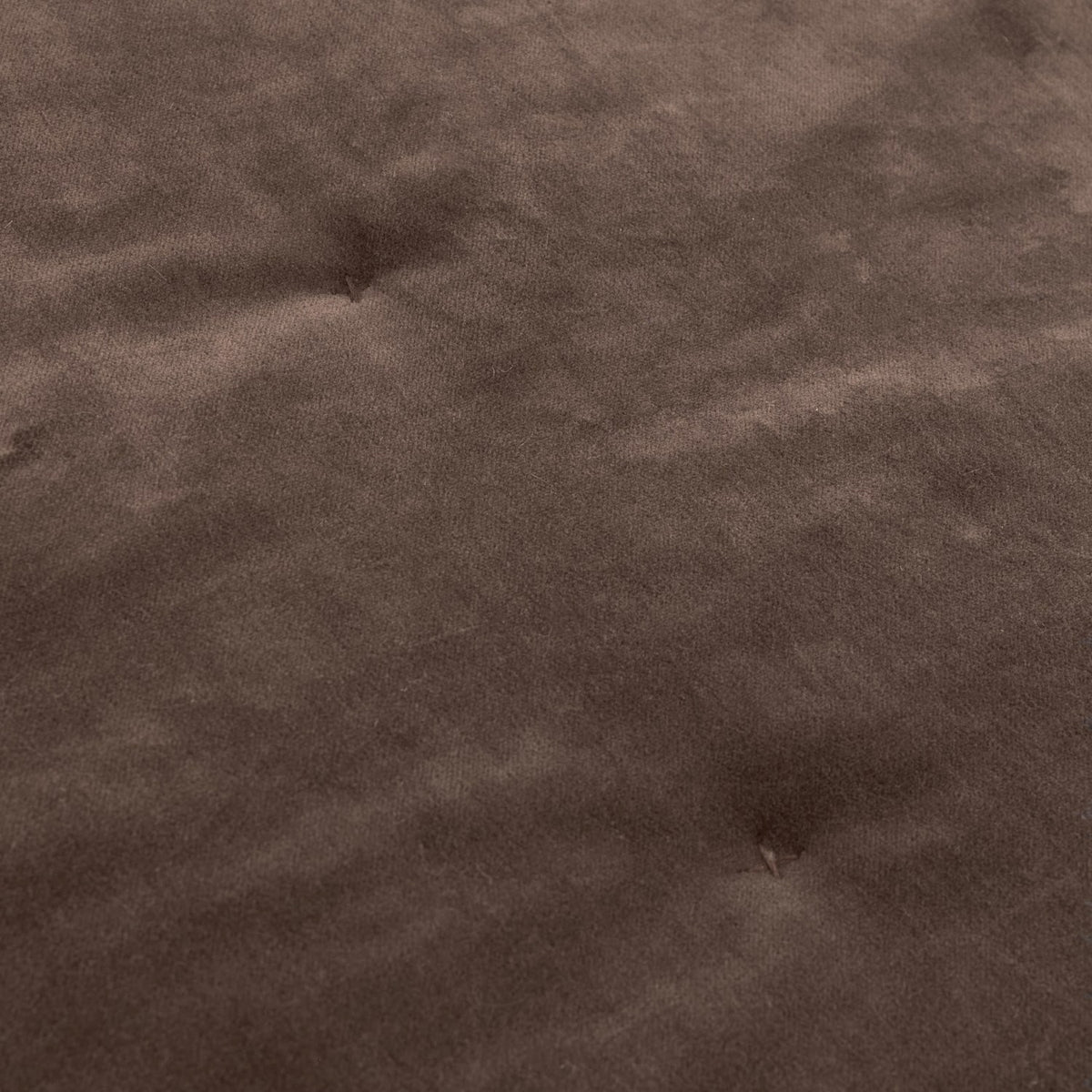 Close-up of the Jaye Velvet Cotton Bedspread in Bitter Chocolate, showing softly mottled brown velvet with subtle quilted tufting detail.