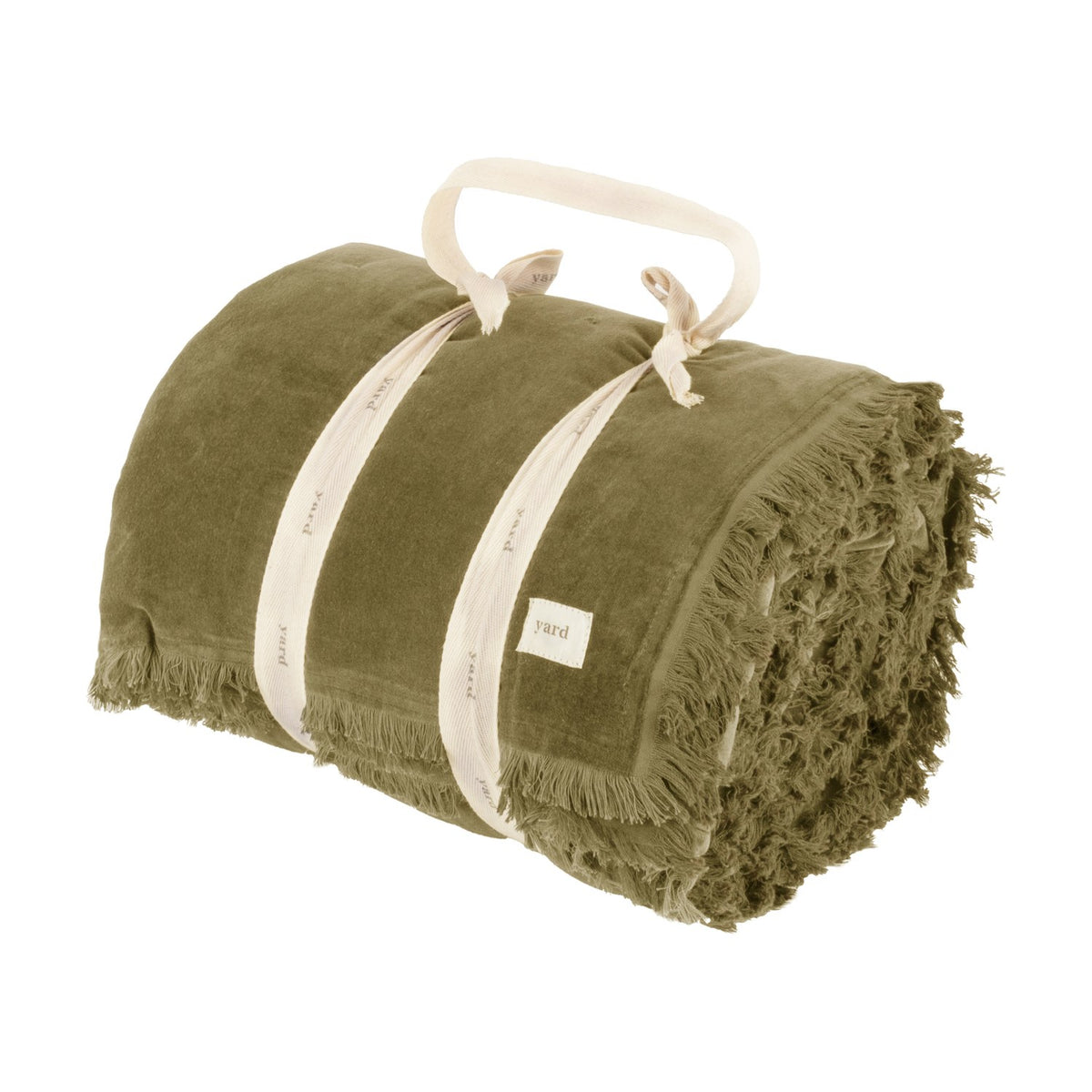 Jaye Velvet Cotton Bedspread in Moss, rolled and tied with cream straps, showing fringed edges and a cream fabric label, on a plain white background.