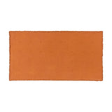 Jaye Velvet Cotton Bedspread in rust orange, shown flat with a fringed edge trim and subtle quilted stitch detail, on a plain white background.