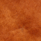 Close-up of the Jaye Velvet Cotton Bedspread in rust, showing the soft velvet pile texture with a subtle stitched detail.