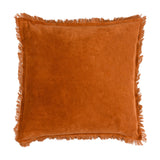 Jaye Velvet Cotton Cushion in rust orange, square with fringed trim along all four edges, plain velvet front shown on a white background.