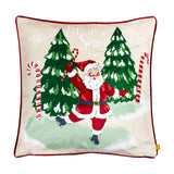 Jolly Santa Plain Velvet Cushion in multi with a printed dancing Santa, candy canes, snowy Christmas trees, and "Let it Snow" text, finished with red piping on a plain background.
