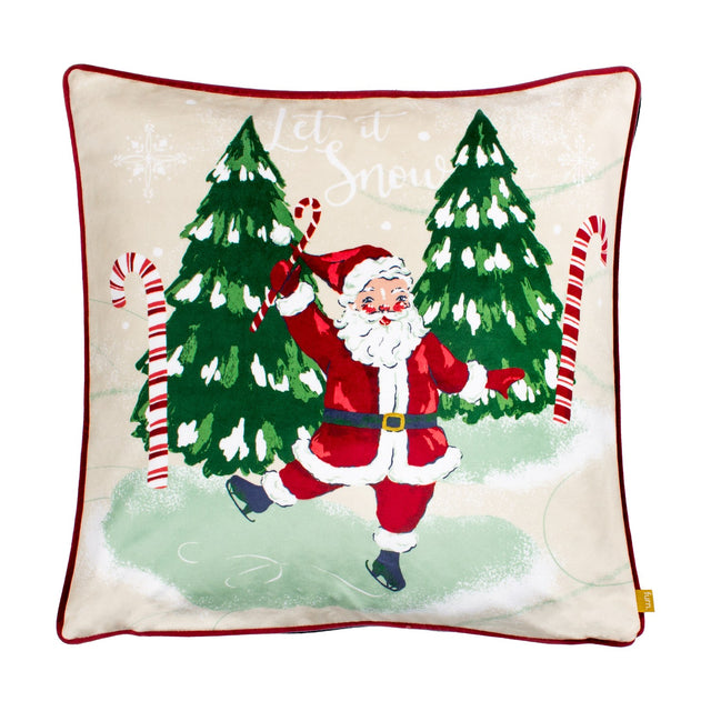 Jolly Santa Plain Velvet Cushion in multi with a printed dancing Santa, candy canes, snowy Christmas trees, and "Let it Snow" text, finished with red piping on a plain background.