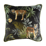 Square black velvet cushion with printed jungle scene featuring two tigers, tropical leaves, a hibiscus flower and a tree frog, finished with green piped edging.