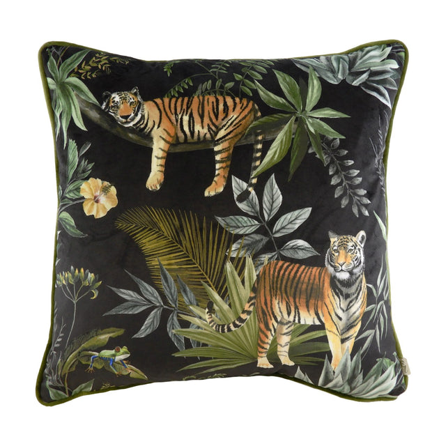 Square black velvet cushion with printed jungle scene featuring two tigers, tropical leaves, a hibiscus flower and a tree frog, finished with green piped edging.