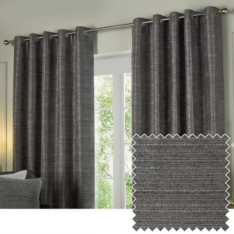 Jupiter Chenille Fully Lined Eyelet Curtains in graphite, hung on a metal pole in a living room, with a fabric swatch showing the ribbed textured weave.