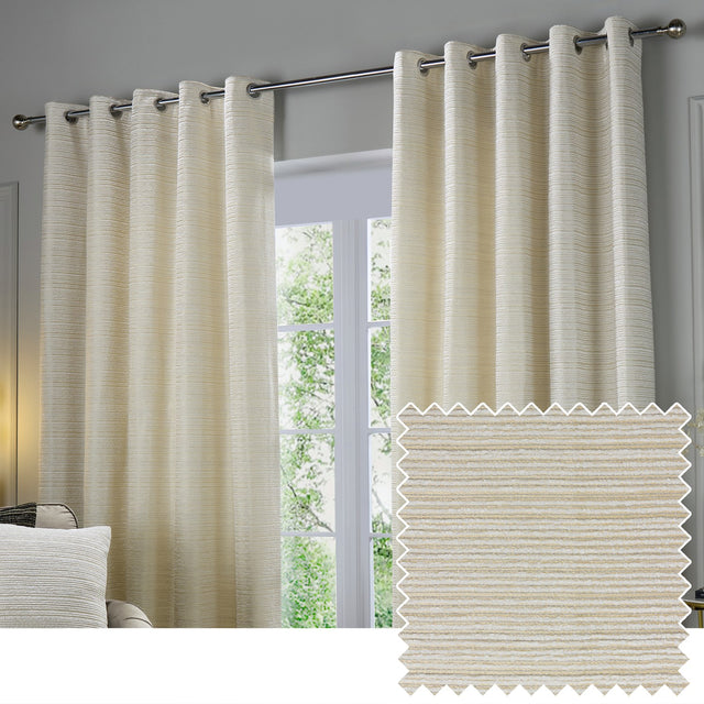 Jupiter Chenille Fully Lined Eyelet Curtains in ivory/gold, hung on a chrome pole with a matching fabric swatch showing the fine horizontal woven texture.