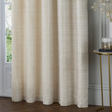 Jupiter Chenille Fully Lined Eyelet Curtains in ivory/gold, hung floor-length by a window, showing fine horizontal woven texture, styled beside a marble side table.