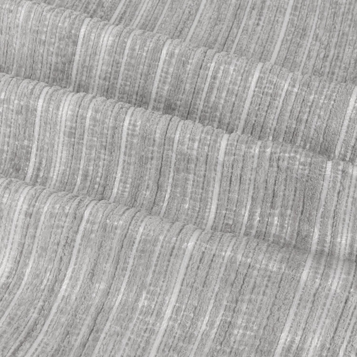 Close-up of Jupiter Chenille Fully Lined Eyelet Curtains in silver, showing the plush pile fabric with fine vertical stripes and soft draped folds.