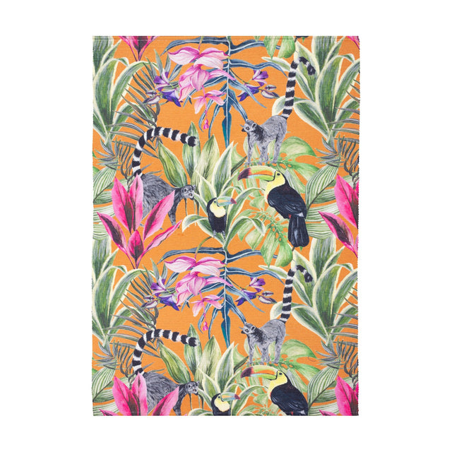 Kali Animals Abstract Polyester Rug in multicolour, a flatweave outdoor rug with a digitally printed jungle scene of lemurs, toucans, palm fronds and flowers on an orange ground.