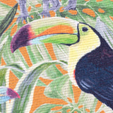 Close-up of the Kali Animals Abstract polyester rug showing a toucan's head and beak amid green palm fronds on an orange background.