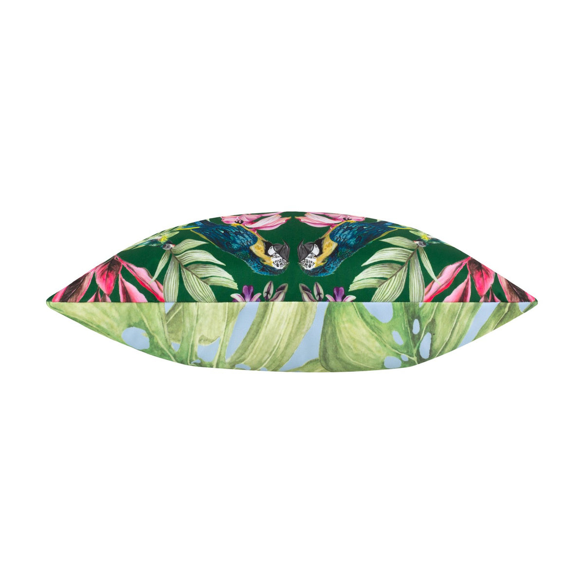 Kali Birds reversible bolster cushion in dark green, shown edge-on with parrots and tropical floral print on one side and leafy pattern on the reverse, plain white background.