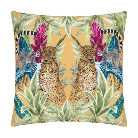 Kali Leopards square cushion in polyester, featuring mirrored leopards, ring-tailed lemurs, and pink blooms amid green jungle foliage on an amber ground, shown on a white background.