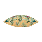 Kali Leopards reversible square cushion shown side-on, revealing a plump polyester insert with amber ground fabric featuring green tropical leaves and pink blooms, on a plain white background.