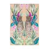 Kali Leopards polyester rug in gold, featuring a mirrored print of two leopards, ringtailed lemurs, green foliage and pink flowers, shown on a plain white background.