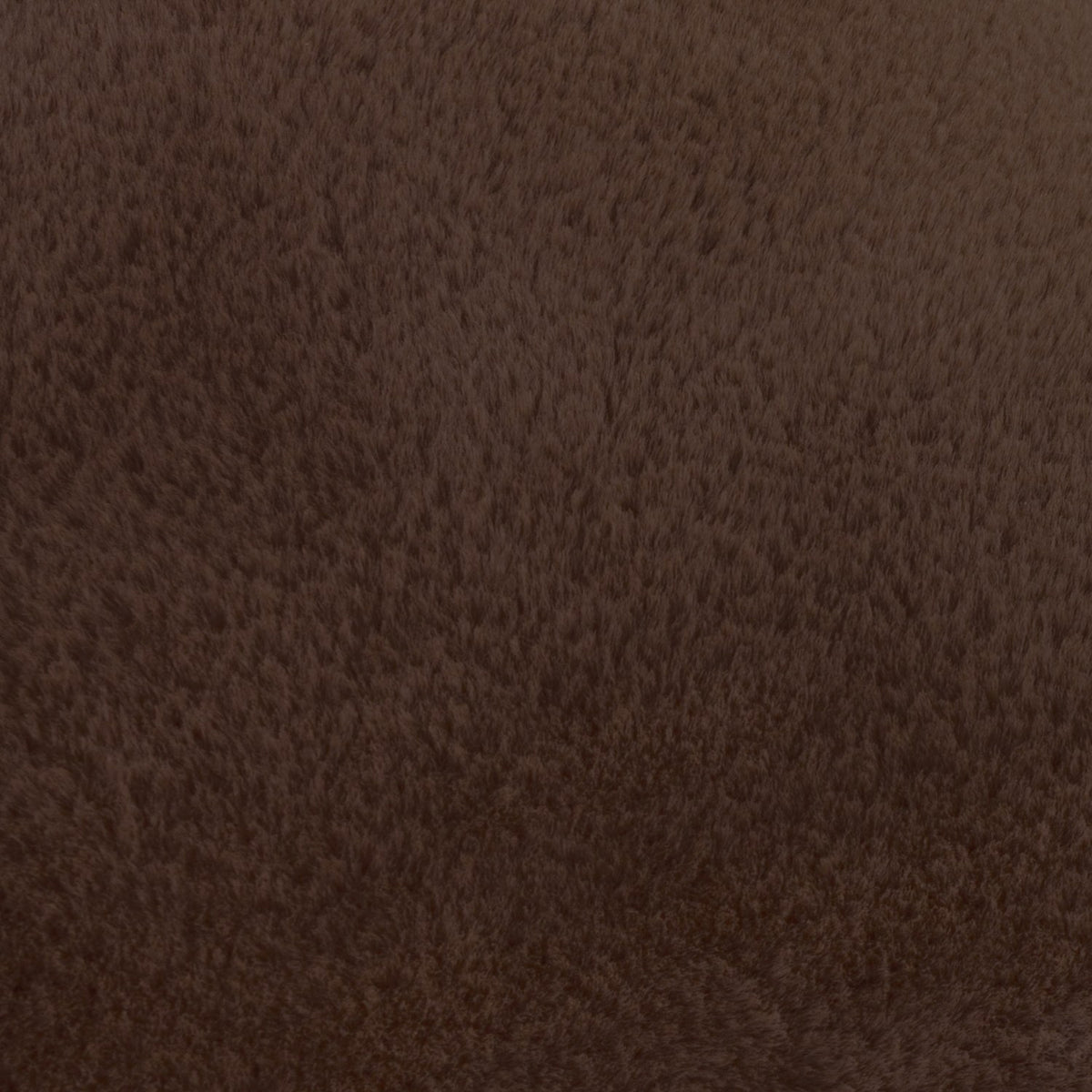 Close-up of the Kallu Plain Faux Fur Cushion in chocolate brown, showing the short, dense faux fur pile texture in polyester fabric.